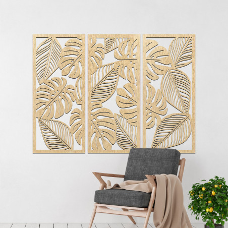Decorațiune murală modernă: trei panouri cu decupaje din frunze de monstera.