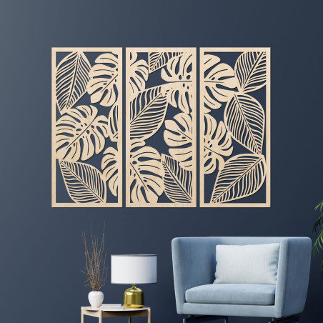 Decorațiune murală modernă: trei panouri cu decupaje din frunze de monstera.