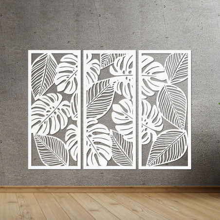 Decorațiune murală modernă: trei panouri cu decupaje din frunze de monstera.